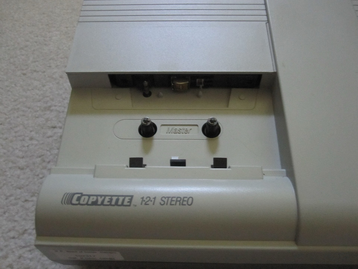 Open cassette duplicator transport viewed from the master side